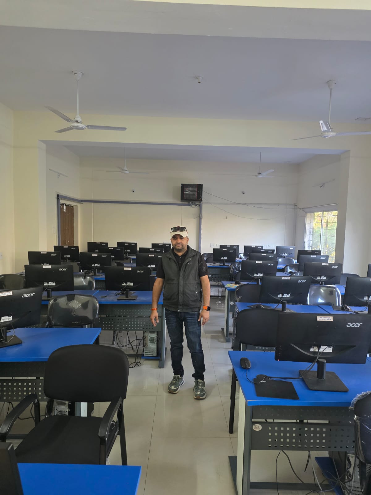 Completed computer lab with rows of Acer desktop computers